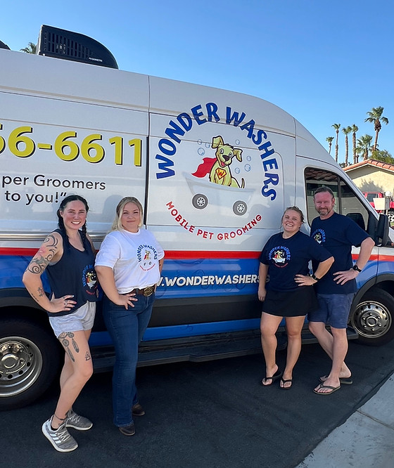 Wonder Washers team with a groomed dog